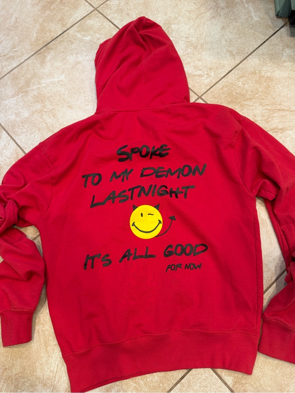Red Hoodie with Smiley Back Print “spoke to my demon last night” Cornerstone